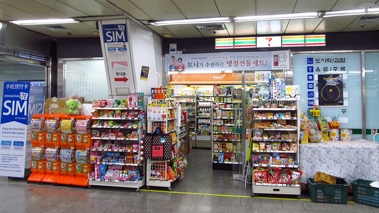 A 7-Eleven store in Korea with a prepaid SIM card display at the entrance