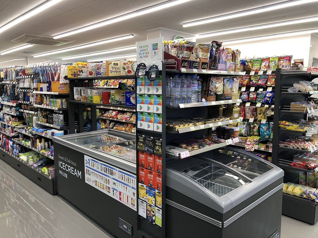 A CU convenience store open at night in a Korean residential street