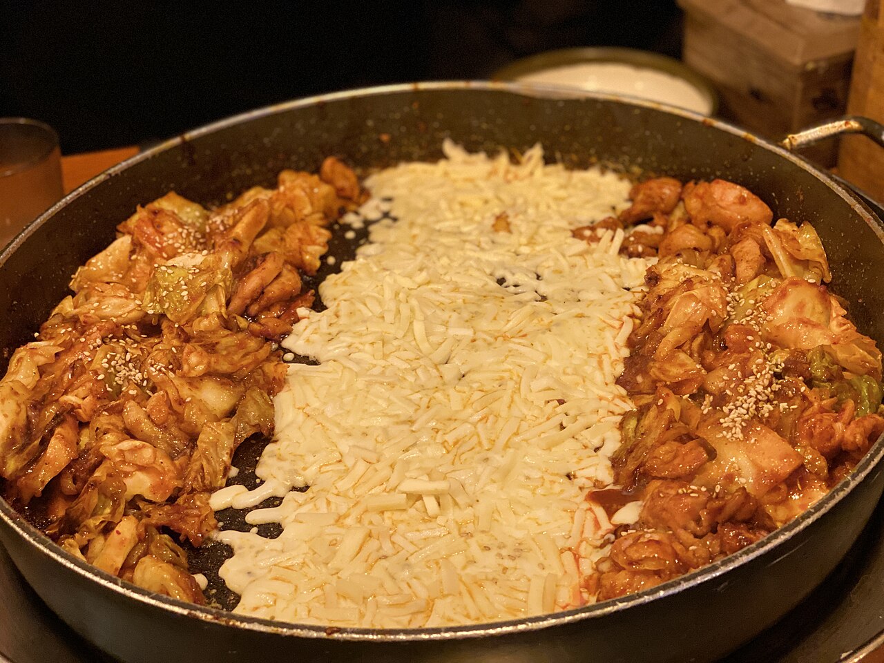 Cheese dakgalbi, spicy stir-fried chicken topped with melted mozzarella
