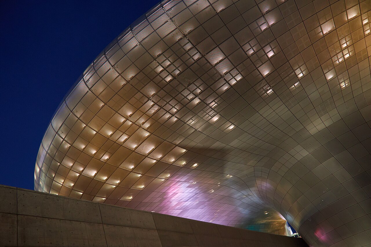 Dongdaemun Design Plaza facade lit at night, the landmark for incheon airport to dongdaemun trips
