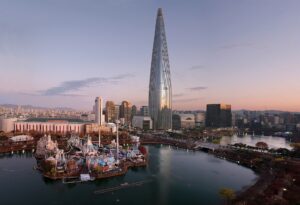Family hotels Seoul: Lotte World Tower and Magic Island beside Seokchon Lake at dawn