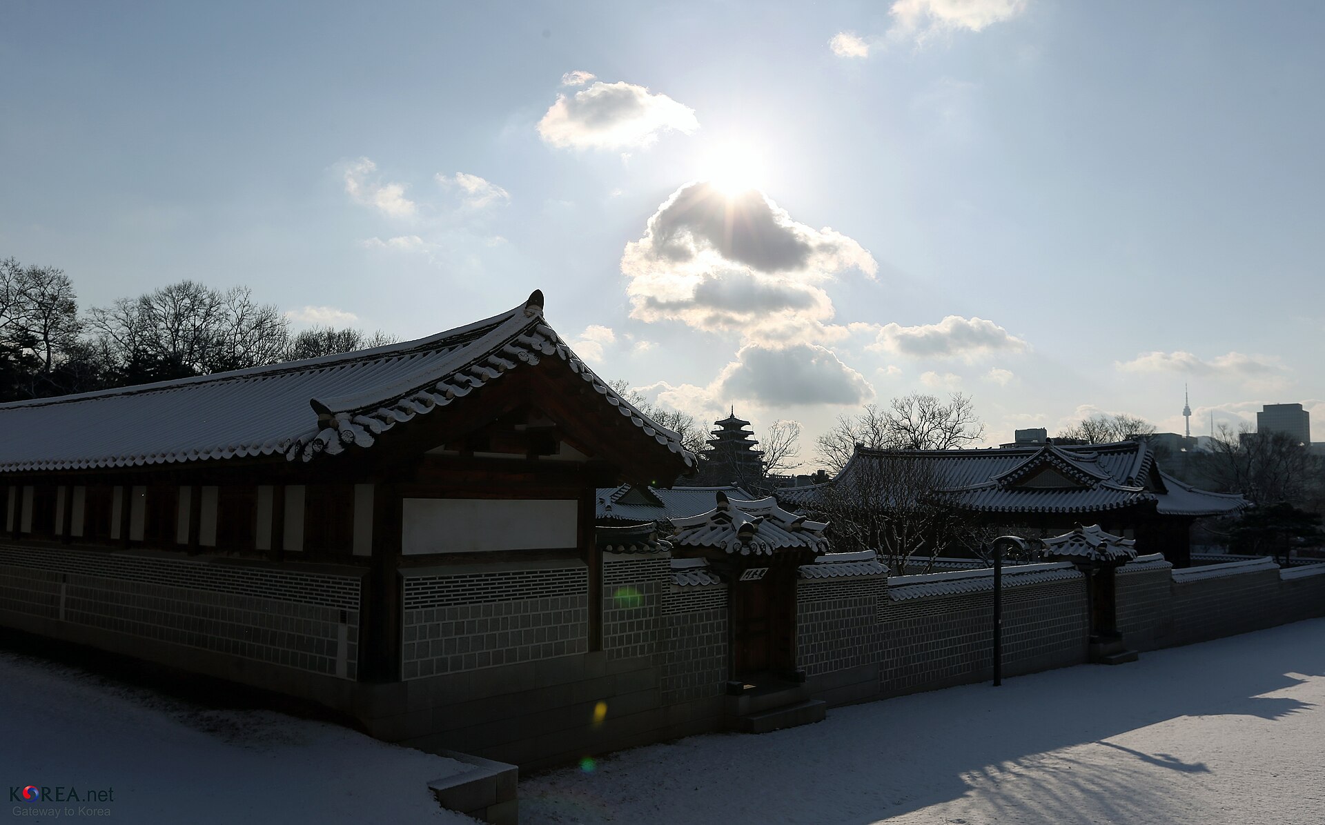 Gyeongbokgung Palace buildings under fresh snow in January