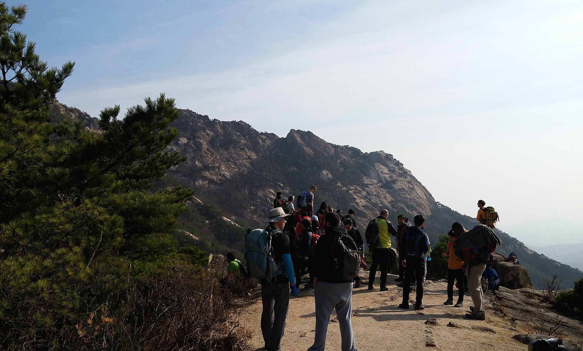 Hikers on a trail in Bukhansan National Park, the most visited hiking area for hiking in Seoul