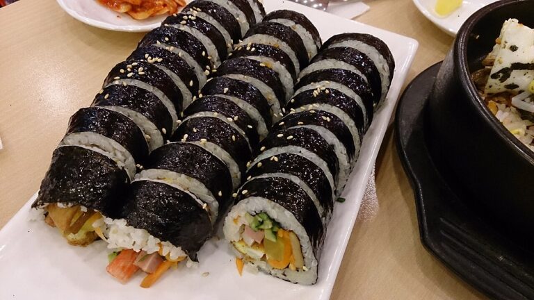 Classic kimbap Seoul: sliced seaweed rice rolls with sesame seeds on a plate