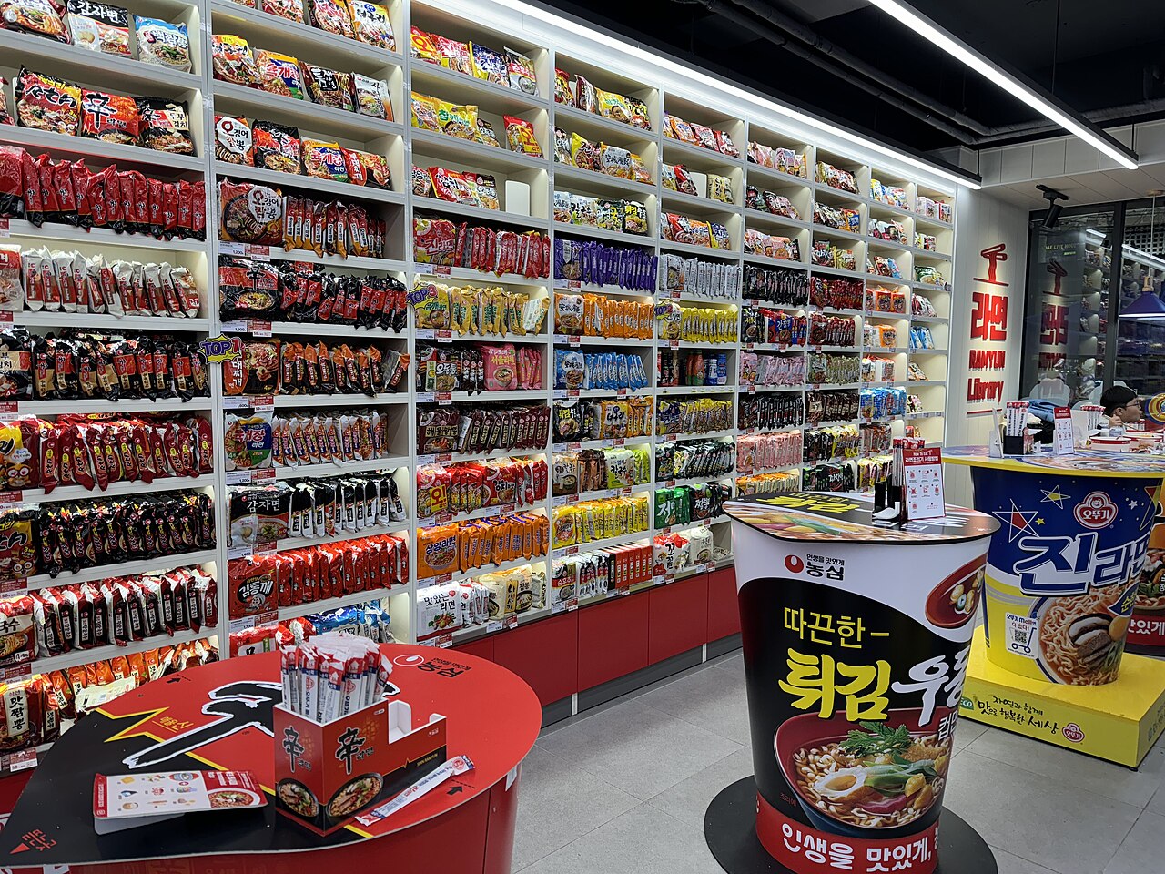 Wall of instant ramyeon packs in a 24-hour Korean convenience store