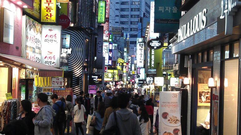 Myeongdong street at night, where many Korean spa Seoul massage and scrub shops cluster