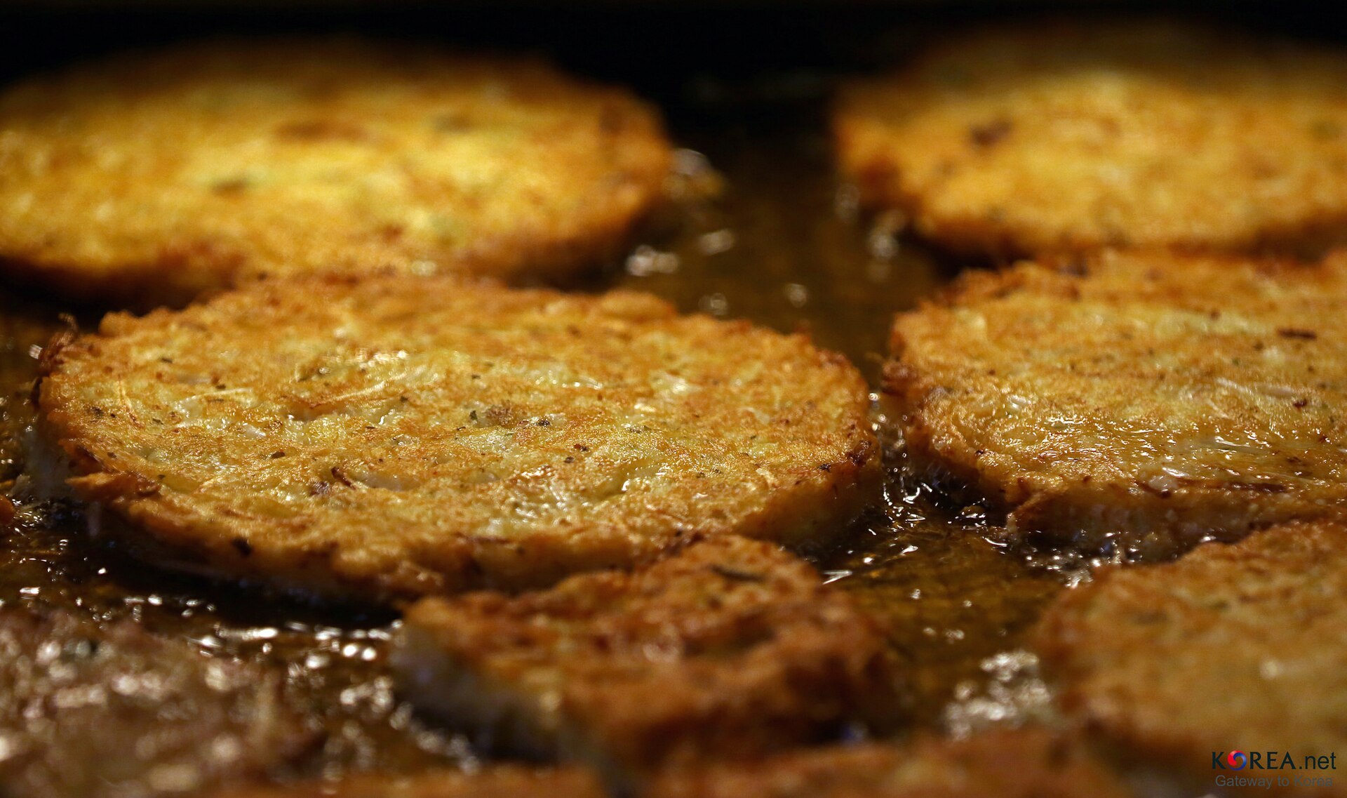 Bindaetteok mung bean pancakes frying at Gwangjang Market in Seoul