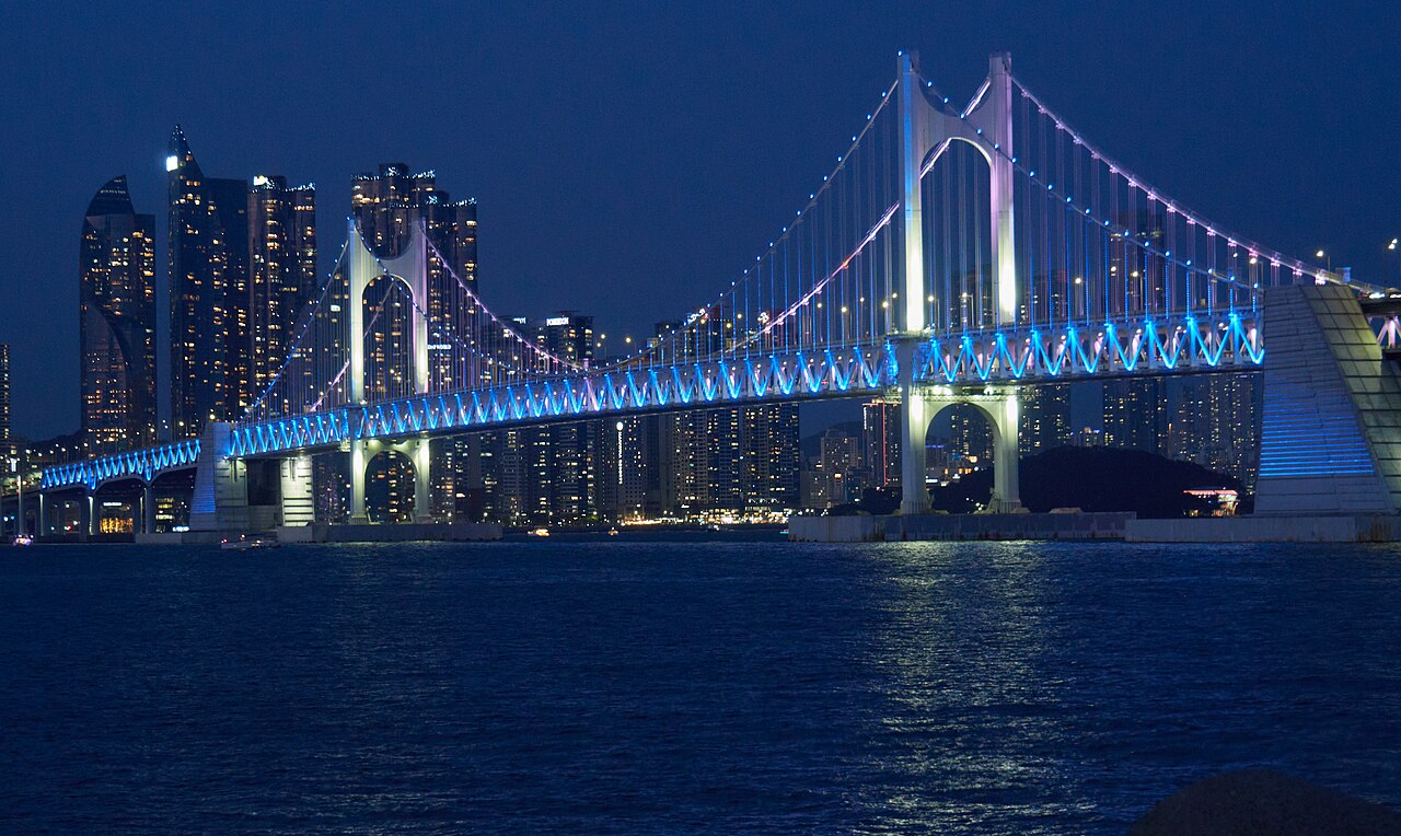 Gwangan Bridge lit up at night over Gwangalli in Busan